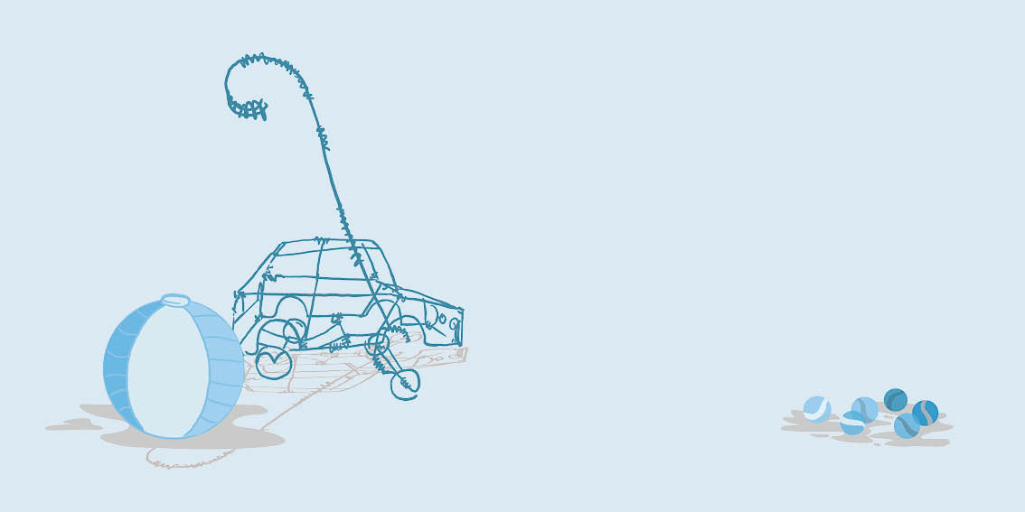 A ball, a toy car and some marbles lie in a puddle.