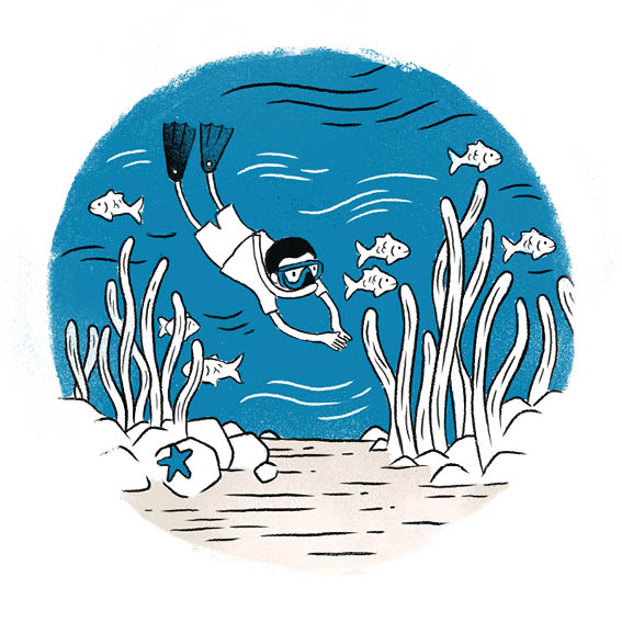 Thato wears goggles and flippers. He swims under the ocean. 