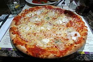 Pizza quattro formaggi at restaurant, Chalk Farm Road, London