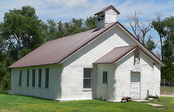 Pilgrim Holiness Church in Arthur, Nebraska. The church was built out of baled straw in 1928 and is listed in the Nation
