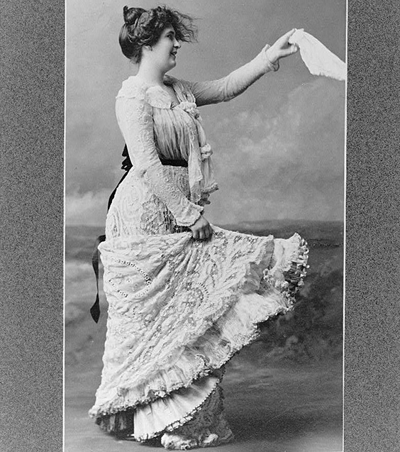 Woman in a lace dress waving a handkerchief, c1900. Prints & Photographs Division, Library of Congress.