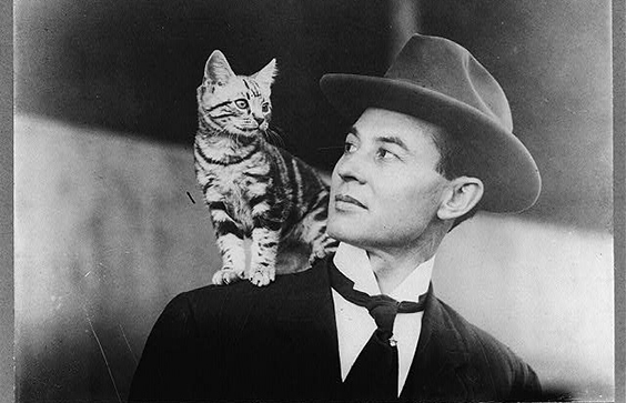 American aviator John B. Moisant looking at cat on his shoulder. 1911. Prints & Photographs Division, Library of Congres