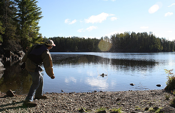 Skipping a stone into the Kawishiwi River. Daakrolb, photographer, 2010. Wikimedia Commons