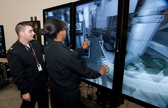 Sailors use a Submarine Engine Room touch-screen training simulator. Oct. 22, 2015. U.S. Navy photo by Mass Communicatio