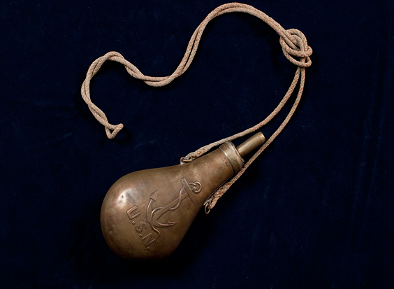 U.S. Navy issue powder flask, made out of brass to prevent any accidental ignition of powder due to sparks or static ele
