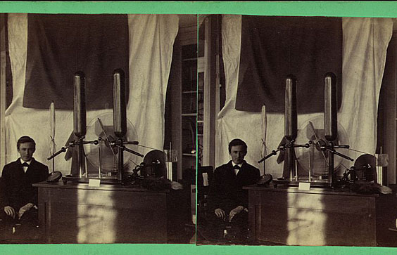 Young man seated next to a Holtz electrostatic influence machine, Dickinson College, 1889. Prints and Photographs Catalo