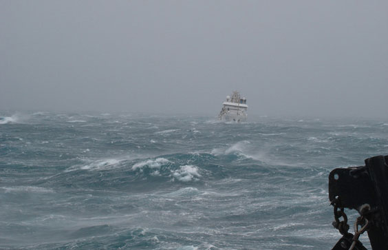 The NOAA Ship Oscar Dyson seen in heavy winds in a probable near shore williwaw. Photo by Crew and Officers of NOAA Ship