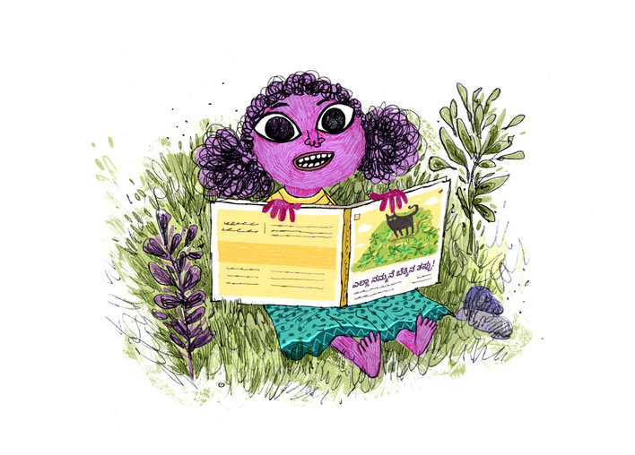 Girl sitting in the garden with a book