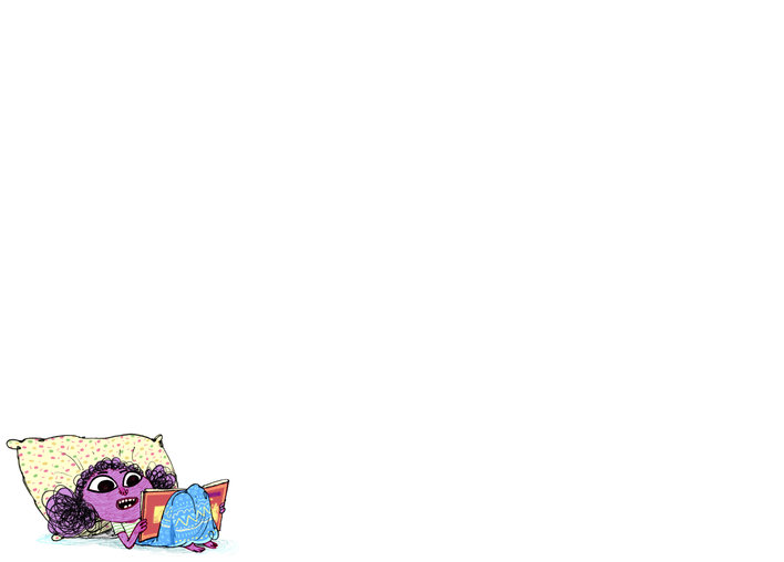 A girl lying down and reading a book