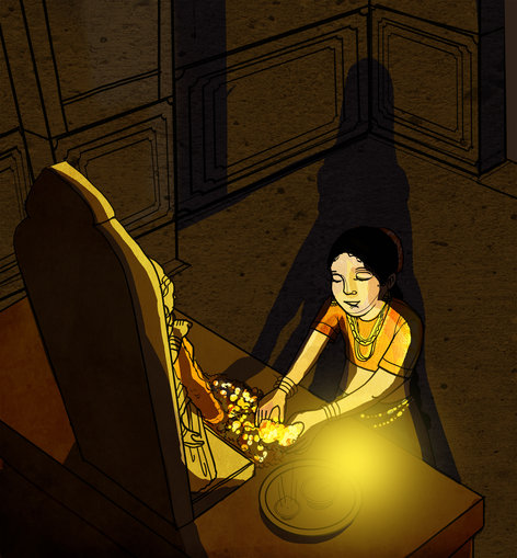 A girl worshipping an idol with lamp