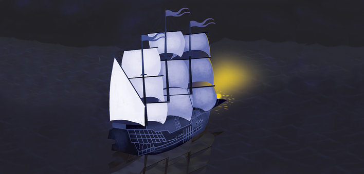 A ship with white sails in the ocean at night