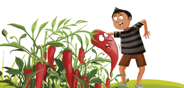 A surprised boy talking to a chilli plant