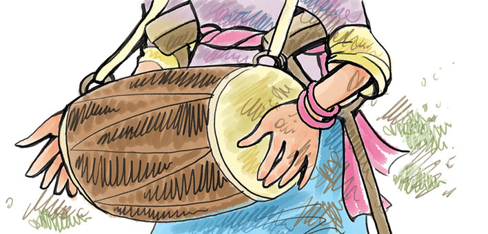 A woman's hands holding a dholak