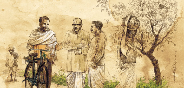 A group of men talking to each other on a village road, and a woman carrying a pot