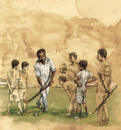 Hockey coach with his team of young boys