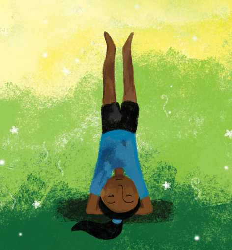 A girl doing a headstand