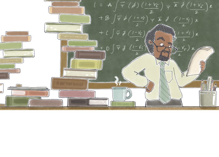 A man working surrounded by books
