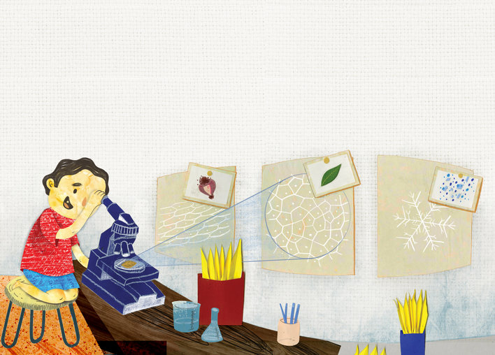 A boy looking through a microscope