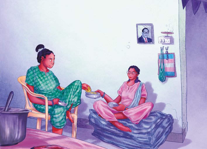 Two women sharing chakris over a meal