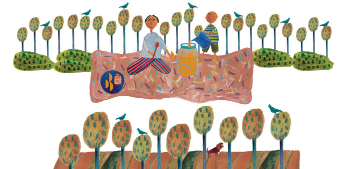Man and a boy on a picnic, surrounded by trees