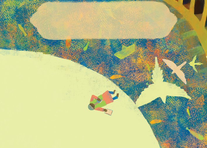 Boy lying down by a pond