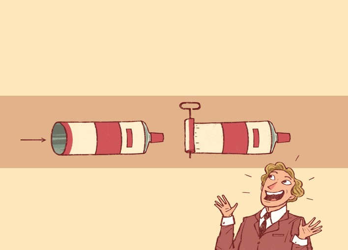 A smiling man, tubes of toothpaste
