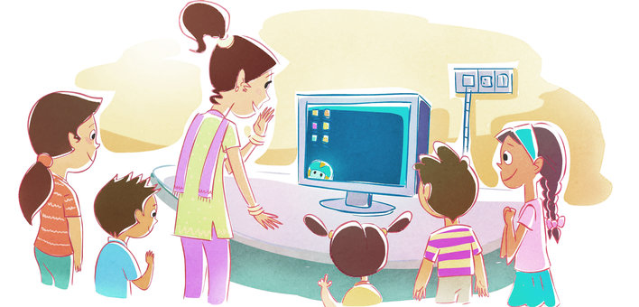 A woman and a group of children around a computer