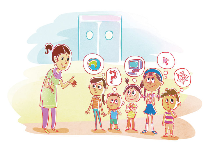 Teacher talking to a group of children about the internet
