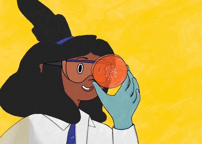 Microbiologist looking through a petri dish