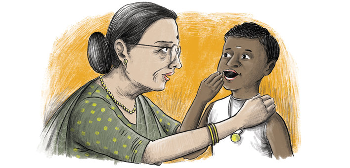 A teacher talking to a boy