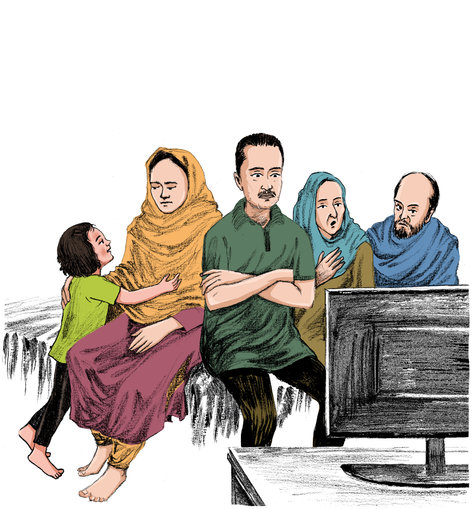 family sitting and watching the television
