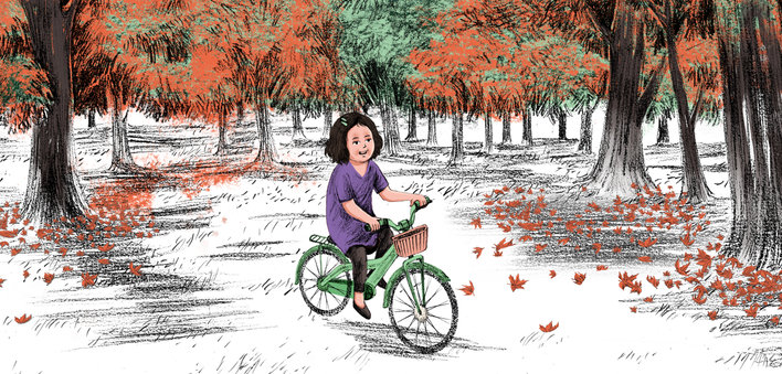 Girl riding a green cycle in the big garden
