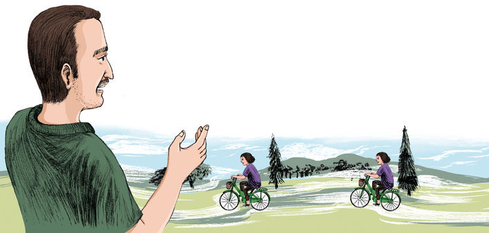 Father watching his daughter ride her cycle