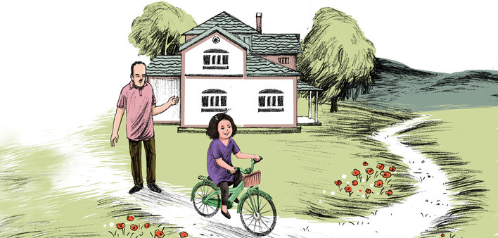 father helps daughter with cycle