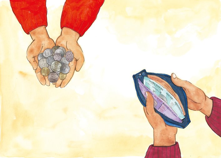 Boy holding a bunch of coins