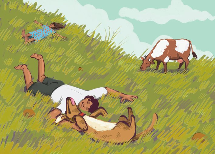 Children rolicking on grass with animals