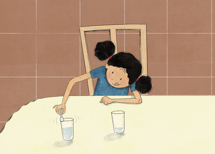 Girl taps a water-filled glass