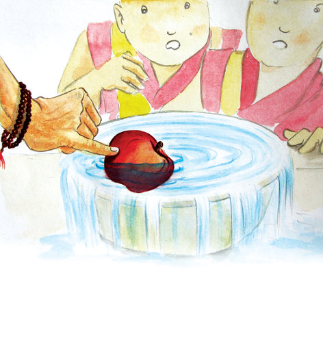 An apple floating in water and people around it