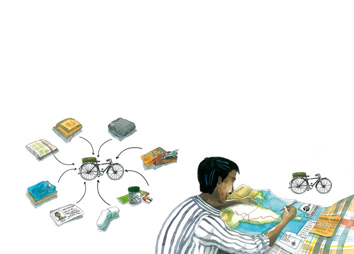 A man sitting with maps