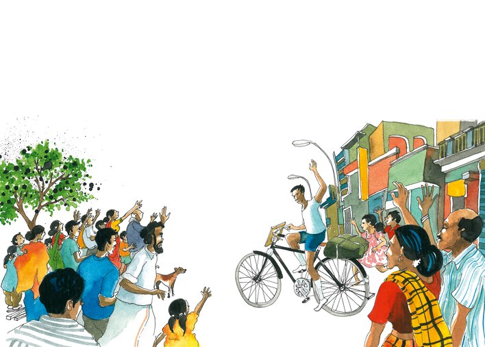 man on a cycle waving to a crowd