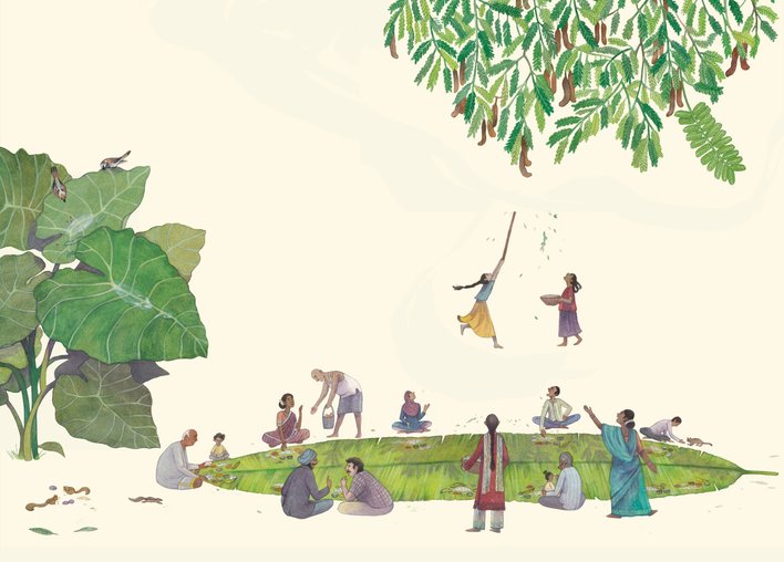 People feasting on a huge banana leaf