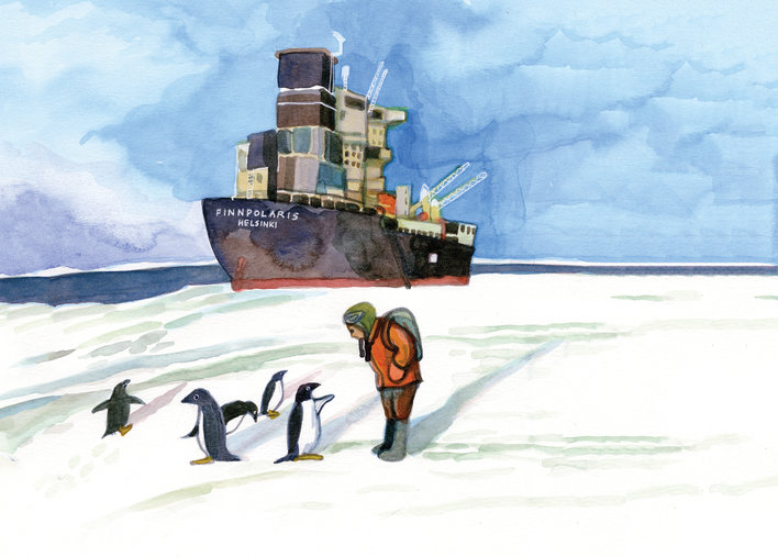 A woman standing by some penguins