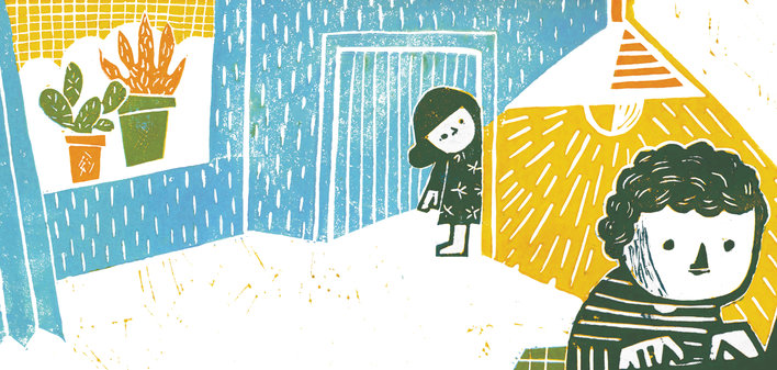 A boy and a girl in a room
