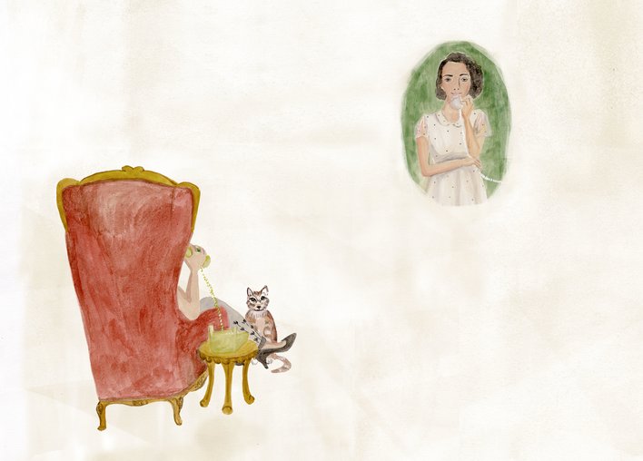 A woman on the phone and a cat