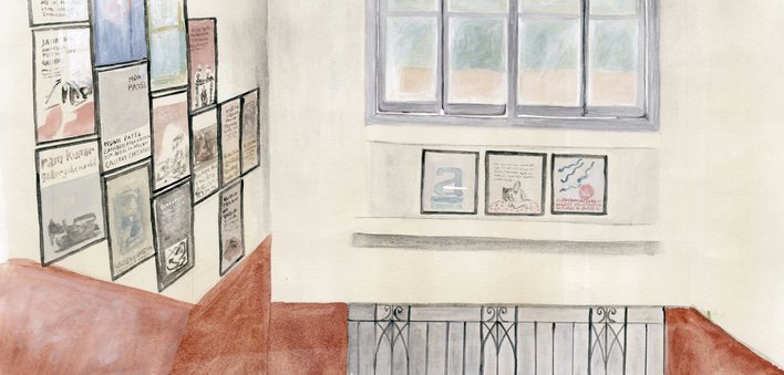 A wall with framed pictures