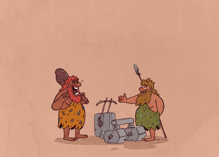 Two men laughing at a primitive looking vehicle