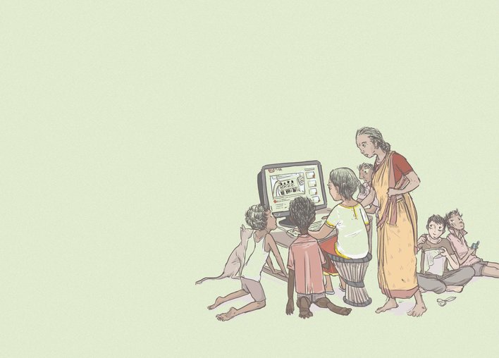 A group of people using a computer