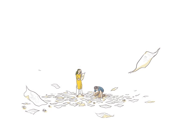 A man and a womon rummaging through a heap of papers