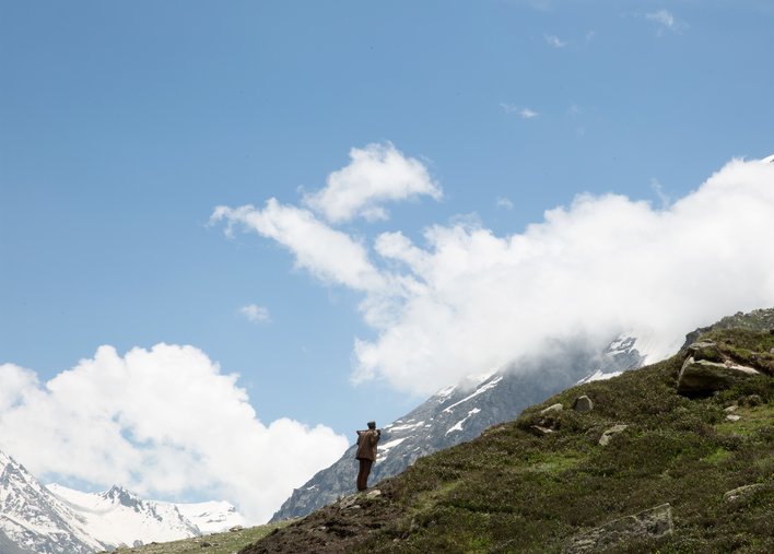A man gazing up at the mountains
