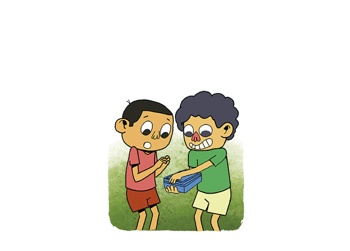 A boy opens the box of laddoos in front of his friend.